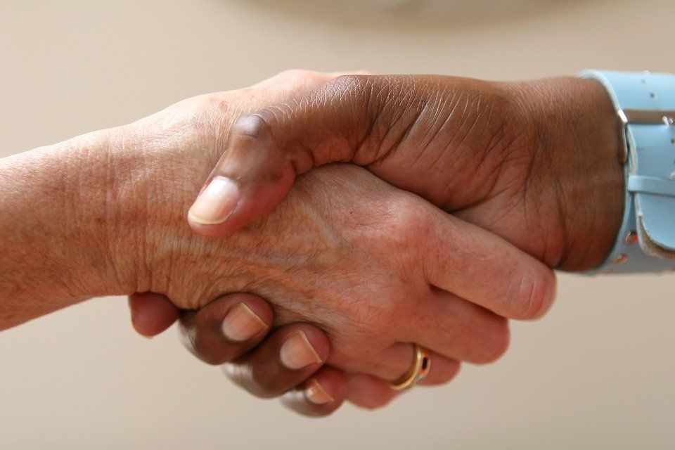Image of people shaking hands in business networking